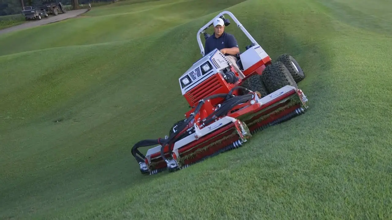 One Tractor is Better Than Two  Mow Slopes Grind Stumps Aerate