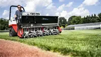 EA600 Aera-Vator Coreless aeration of a baseball field with the Ventrac Aera-Vator, an essential addition to municipal mowers and school mowing. Lawn aerator equipment.