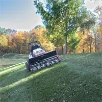 EA600 Aera-Vator On slopes and uneven terrain, the Aera-Vator improves seed-to-soil contact during fall overseeding, and Ventrac’s low center of gravity keeps you steady and in control.