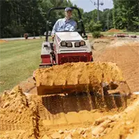 HE482 Power Bucket Transport sand piles to any area of the yard with the Power Bucket, making yard leveling and prep faster and more efficient.