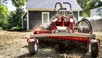 KG540 Power Rake Push and redistribute soil, gravel, or loose debris efficiently with the drum’s reversible rotation and adjustable wings.
