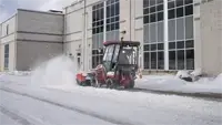 KJ Broom Operators stay efficient in winter storms by hydraulically angling the broom to direct snow exactly where it needs to go.