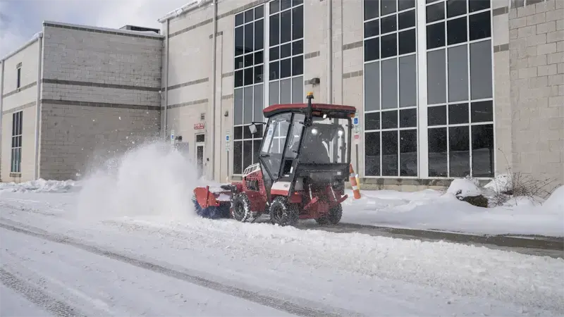 Operators stay efficient in winter storms by hydraulically angling the broom to direct snow exactly where it needs to go.
