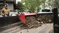 KM500 Loader The KM500 Loader with Standard Bucket lifts and dumps debris directly into a trailer, helping contractors efficiently clear job sites and haul material off the property.