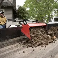 KM500 Loader The KM500 Loader with Standard Bucket lifts and dumps debris directly into a trailer, helping contractors efficiently clear job sites and haul material off the property.
