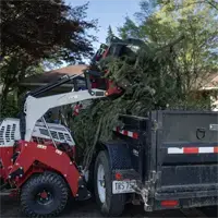 KM100 Rock Bucket w/ Grapple Optimize debris removal by using the Rock Bucket with Grapple to load material directly into dump trailers, saving time and reducing cleanup effort.