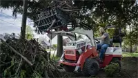 KM100 Rock Bucket w/ Grapple Clean up storm debris fast — the Rock Bucket with Grapple grabs limbs, branches, and tangled piles in one pass.