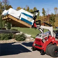 KM410 Pallet Forks Gain 50-inch fork clearance when fully raised, enabling operators to lift pallets over obstacles and dump into high trailers with precision.
