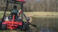 Keep pond edges clean and vegetation-free with the Ventrac MA900 Boom Mower, perfect for trimming overgrown plants and maintaining waterway aesthetics.