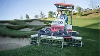 MR770 Reel Mower Maneuver tight around bunkers—the compact 77-inch width and articulating tractor give operators precision control near sand traps.