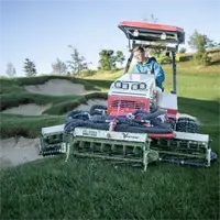 MR770 Reel Mower Maneuver tight around bunkers—the compact 77-inch width and articulating tractor give operators precision control near sand traps.