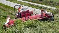 Mowing steep slopes with the MWMY Flail Mower shows off its ability to stay stable while cutting dense, tall grass.