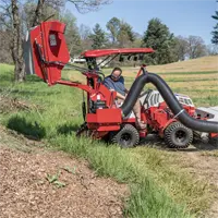 RV Vac Collection System The RV602 demonstrates its high-lift capability by unloading collected grass clippings into a dump trailer, streamlining the disposal process for large estates and municipalities.