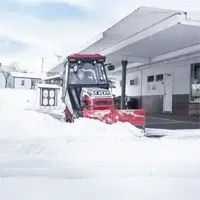 The compact size of the Ventrac tractor, paired with the SE530 V-Blade, makes it possible to clear snow under building overhangs where larger equipment can’t operate—even with the winter cab installed.