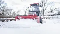 SP720 Box Plow Clearing snow in tight commercial lots: the compact Ventrac + Box Plow combination excels in maneuverability.