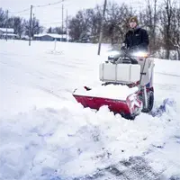 NE380 Snow Bucket Clearing access to a driveway becomes much faster when using the NE380 Snow Bucket to scoop, lift, and carry heavy snow piles out of the way with hydraulic precision.