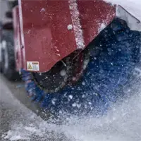 When debris and packed snow build up along a public plaza, the NJ380’s reversible bristles clean efficiently in both directions, reducing manual labor and improving turnaround time.