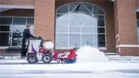 Clearing walkways in front of a school, the NJ380 Sidewalk Snow Broom reaches curb edges and crosses thresholds with minimal effort, keeping student paths and drop-off zones safe and clear.