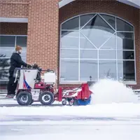 Clearing walkways in front of a school, the NJ380 Sidewalk Snow Broom reaches curb edges and crosses thresholds with minimal effort, keeping student paths and drop-off zones safe and clear.