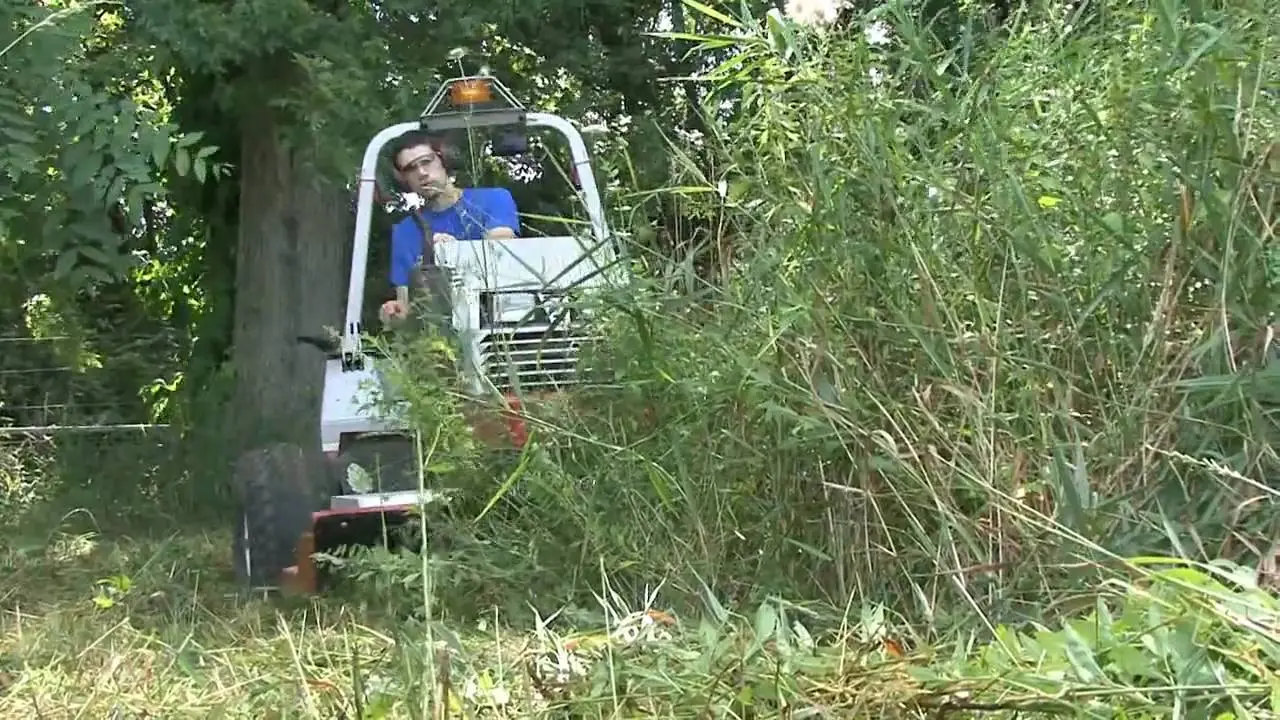 Ventrac destroys giant weeds  Extended